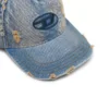 c-enic Denim pet met gerafelde details en geborduurd logo